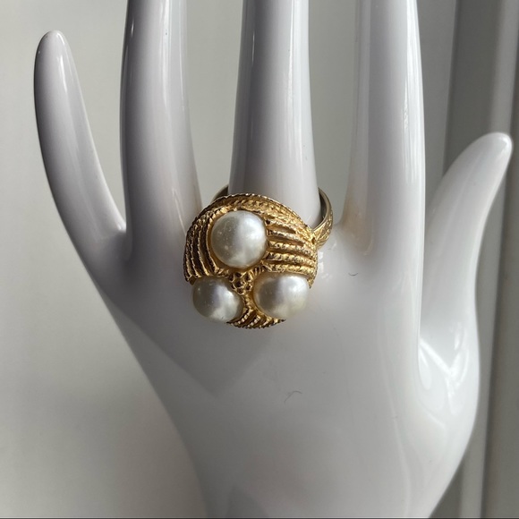 vintage gold tone faux pearl ring Jewelry - Vintage faux pearls and gold tone etched band ring. Size 7 adjustable. Used.